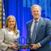 DOD’s Leslie Beavers Accepts 2024 Wash100 Award From Executive Mosaic CEO Jim Garrettson
