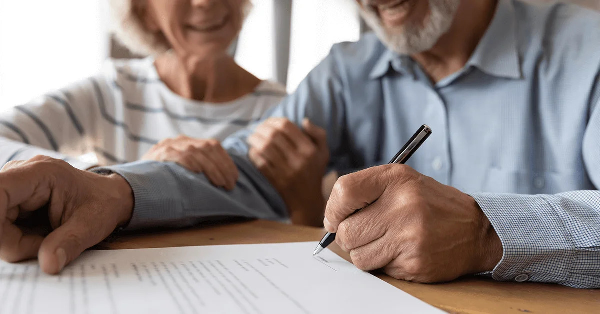 A veteran signing a contract