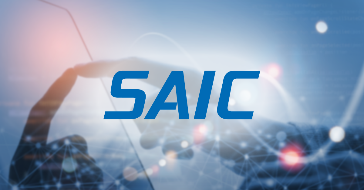SAIC's official logo on a slightly blurred image of hands and orbits